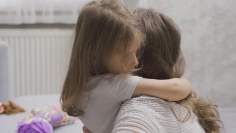 Sad-little-girl-hugging-her-mother.-Love-of-Mother.